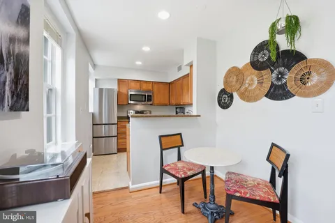 a living room with kitchen island furniture and a window