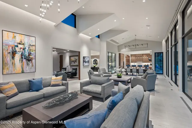 a living room with furniture and a table