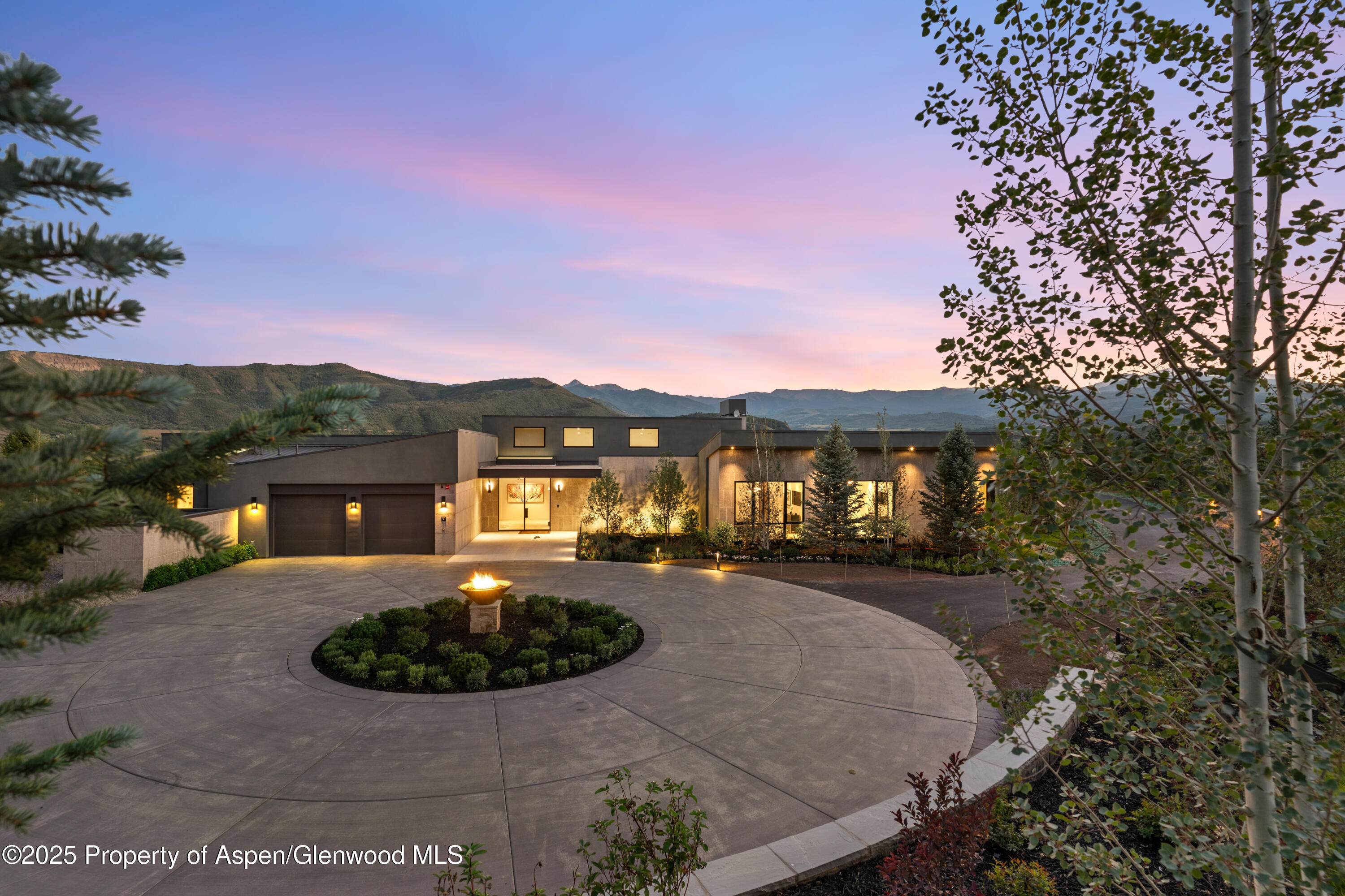 6890 East Sopris Creek Road Snowmass, CO 81654 - Photo 2 of 40 a view of a big house with a big yard and potted plants
