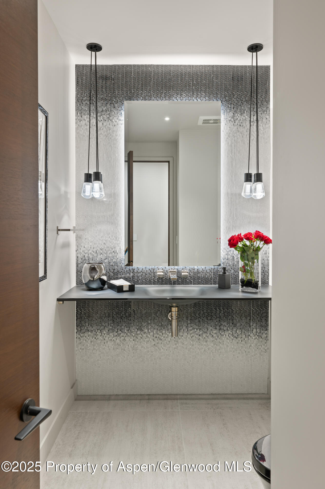 6890 East Sopris Creek Road Snowmass, CO 81654 - Photo 23 of 40 a bathroom with a sink and a mirror