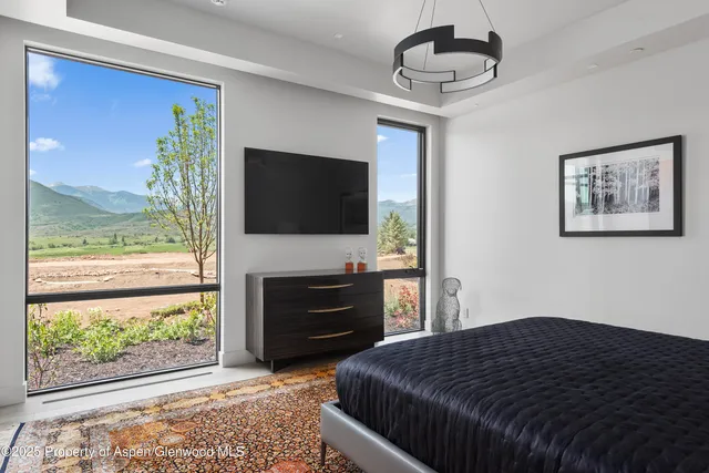 a bathroom with double vanity sink and a mirror
