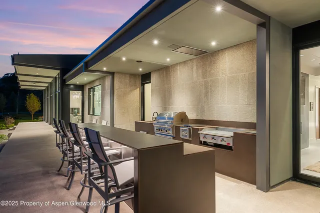 a view of a lush green hillside and houses