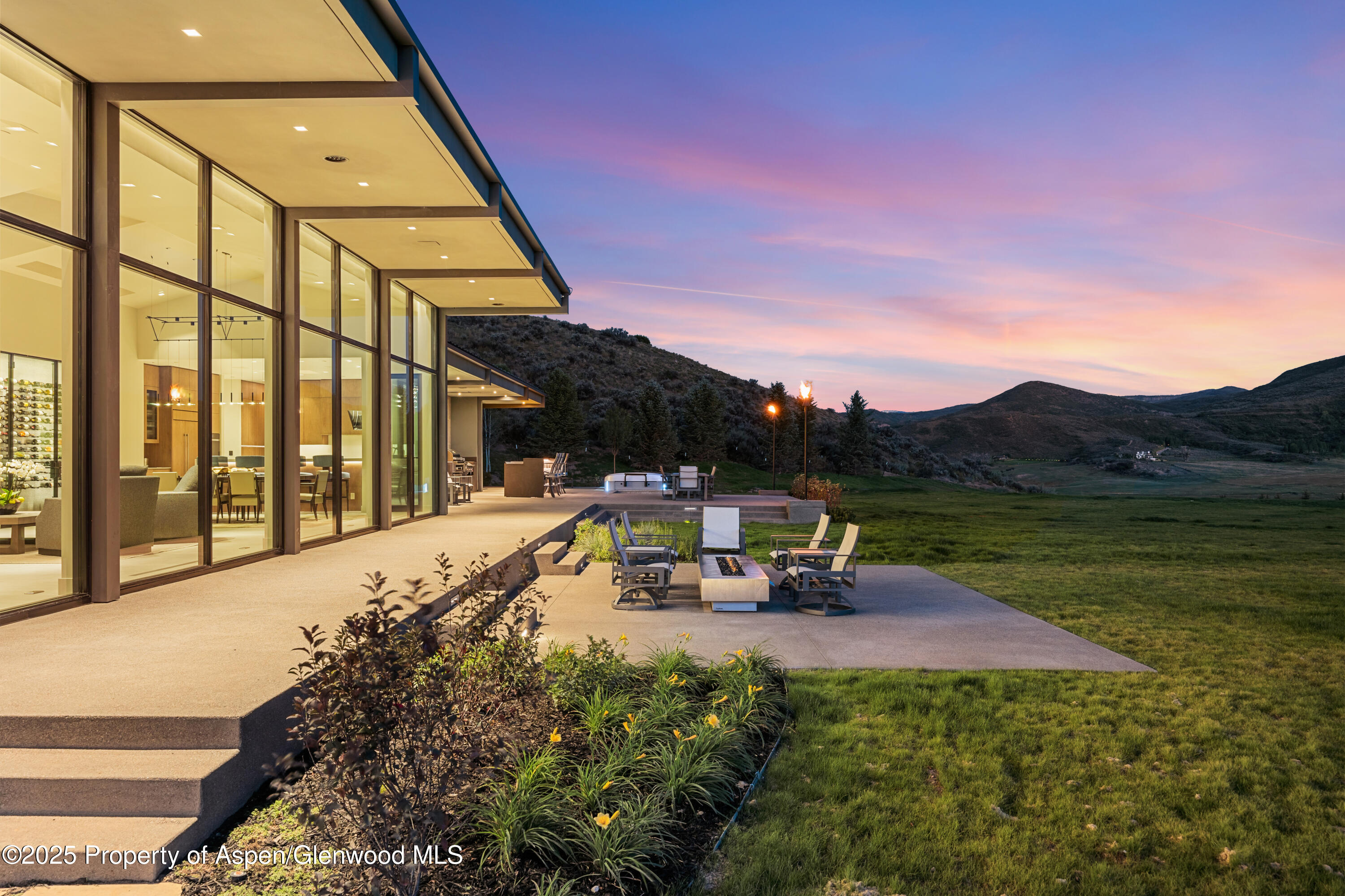 6890 East Sopris Creek Road Snowmass, CO 81654 - Photo 39 of 40 a view of swimming pool with seating area and mountain view in back