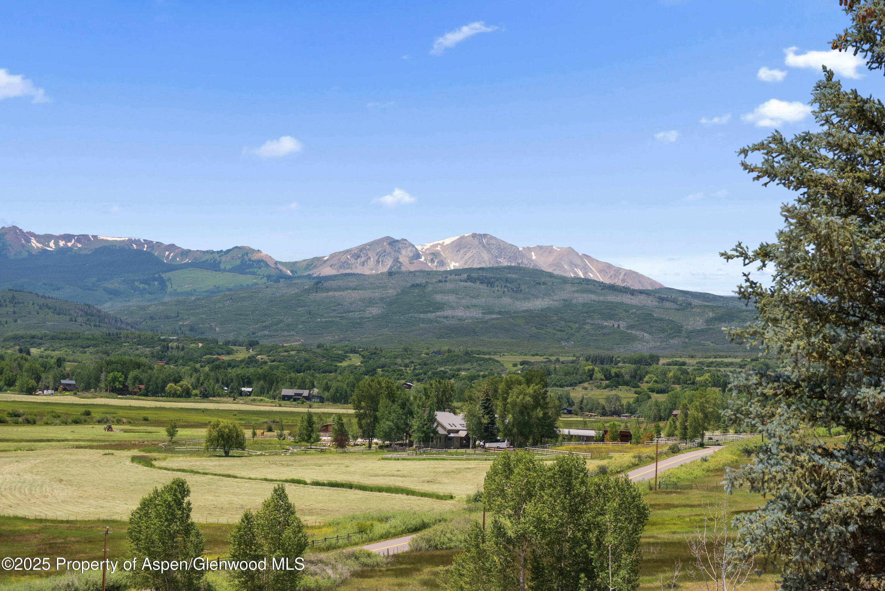 6890 East Sopris Creek Road Snowmass, CO 81654 - Photo 40 of 40 a view of a lake with mountains in the background