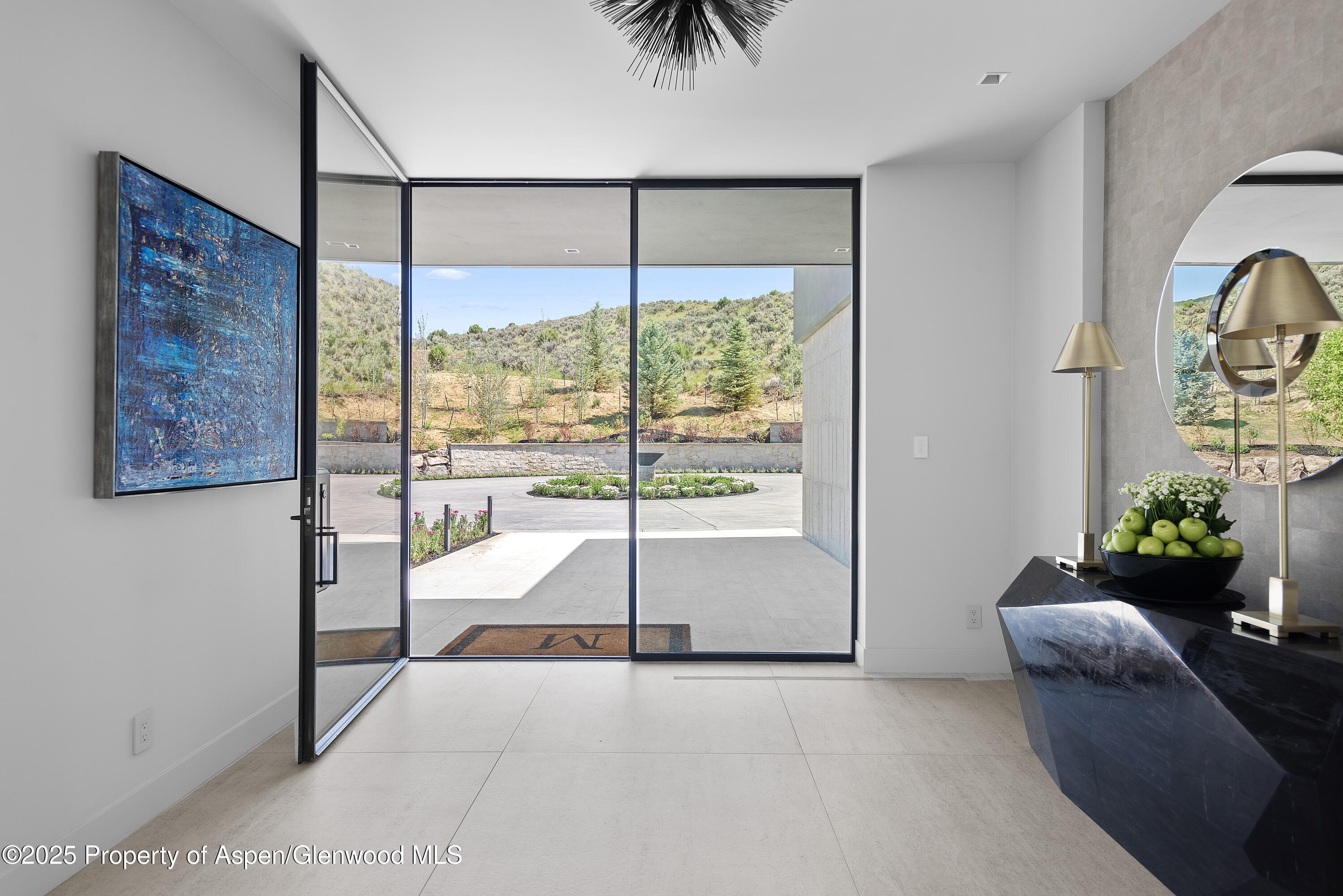 6890 East Sopris Creek Road Snowmass, CO 81654 - Photo 4 of 40 a living room with furniture and a potted plant
