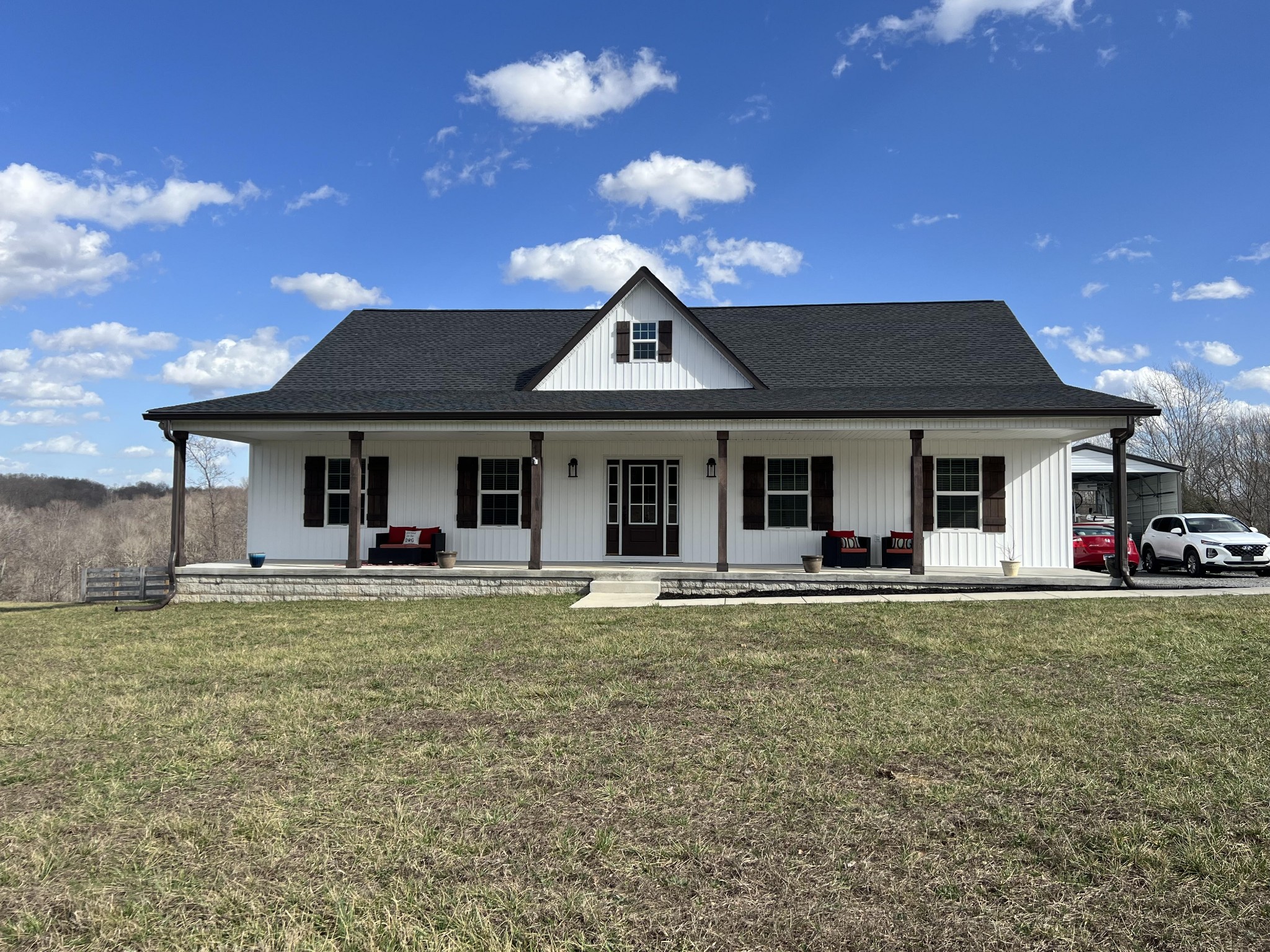 1951 Oak Grove Road Red Boiling Springs, TN 37150 - Photo 1 of 60 a front view of a house with garden and porch