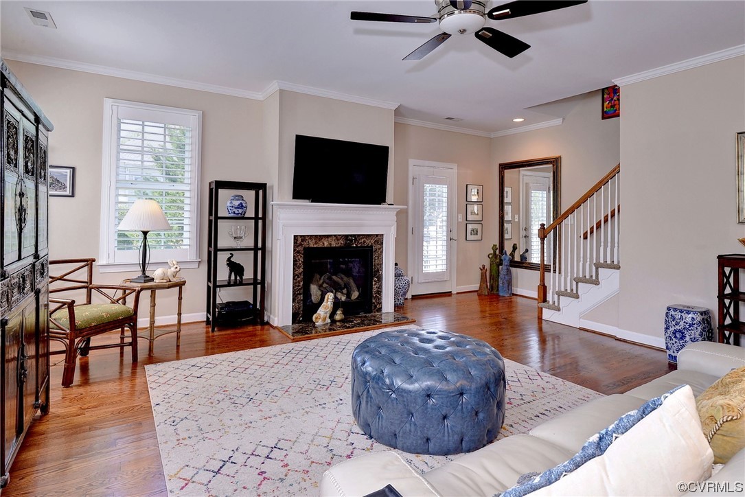 232 Beeston Fields Williamsburg, VA 23188 - Photo 14 of 39 a living room with furniture a fireplace and a flat screen tv