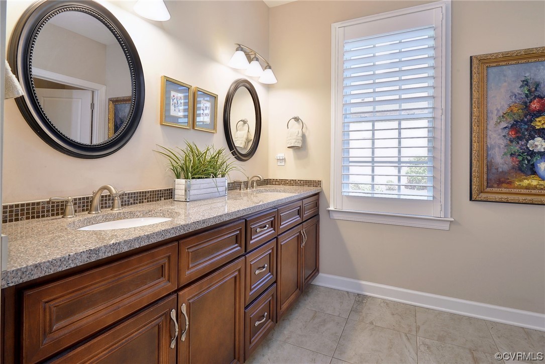 232 Beeston Fields Williamsburg, VA 23188 - Photo 18 of 39 a bathroom with a granite countertop double vanity and a mirror