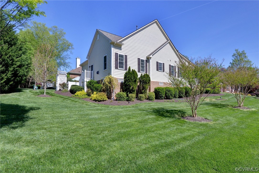 232 Beeston Fields Williamsburg, VA 23188 - Photo 32 of 39 a view of a house with backyard and a tree