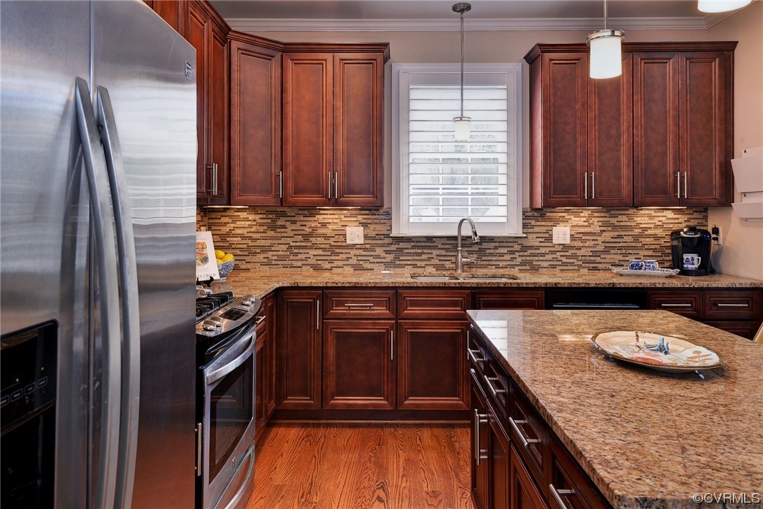 232 Beeston Fields Williamsburg, VA 23188 - Photo 9 of 39 a kitchen with kitchen island granite countertop wooden cabinets a sink and a stove