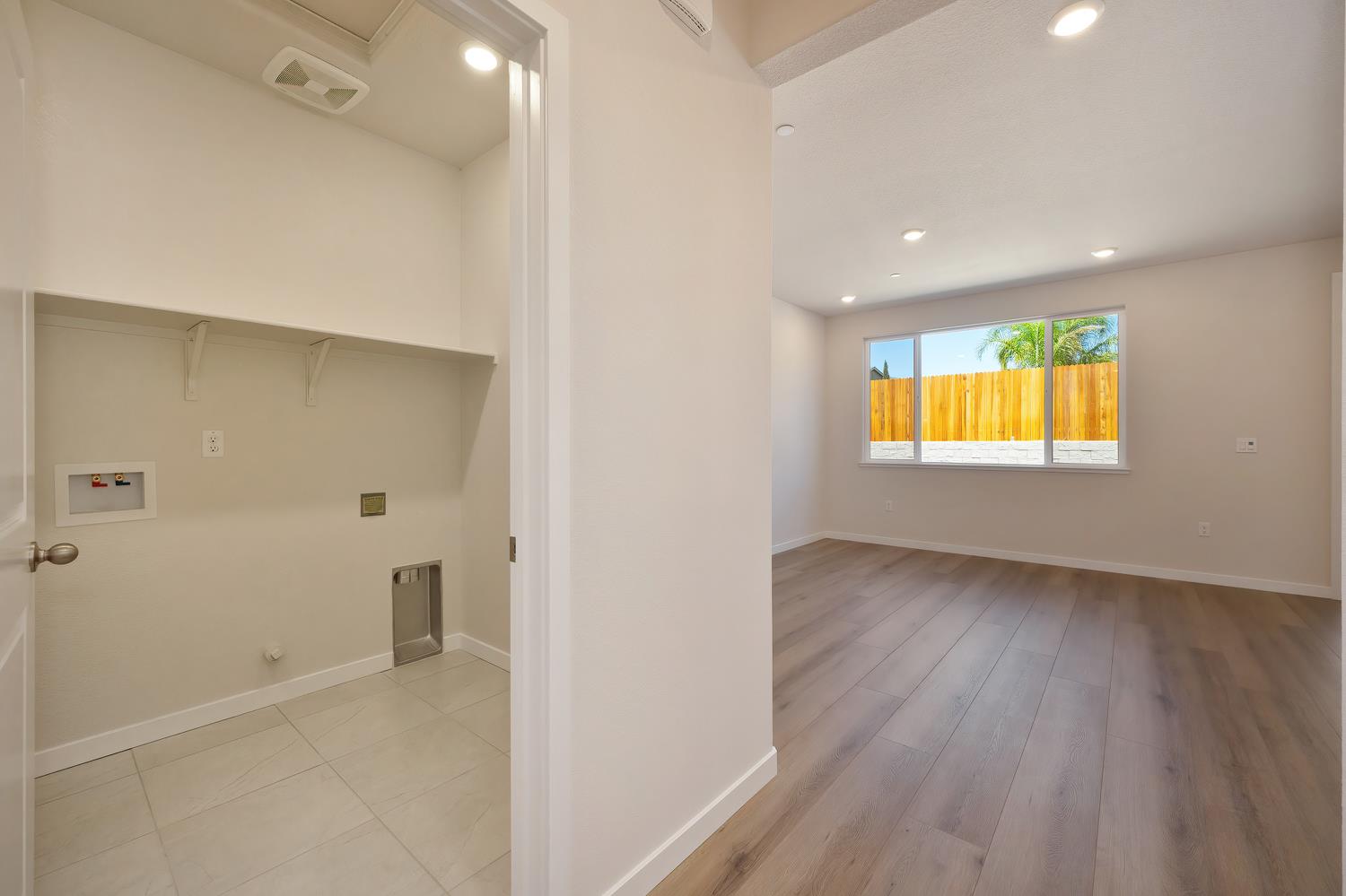 1089 Mallory Ridge Street Roseville, CA 95747 - Photo 30 of 36 a view of an empty room with wooden floor and a window