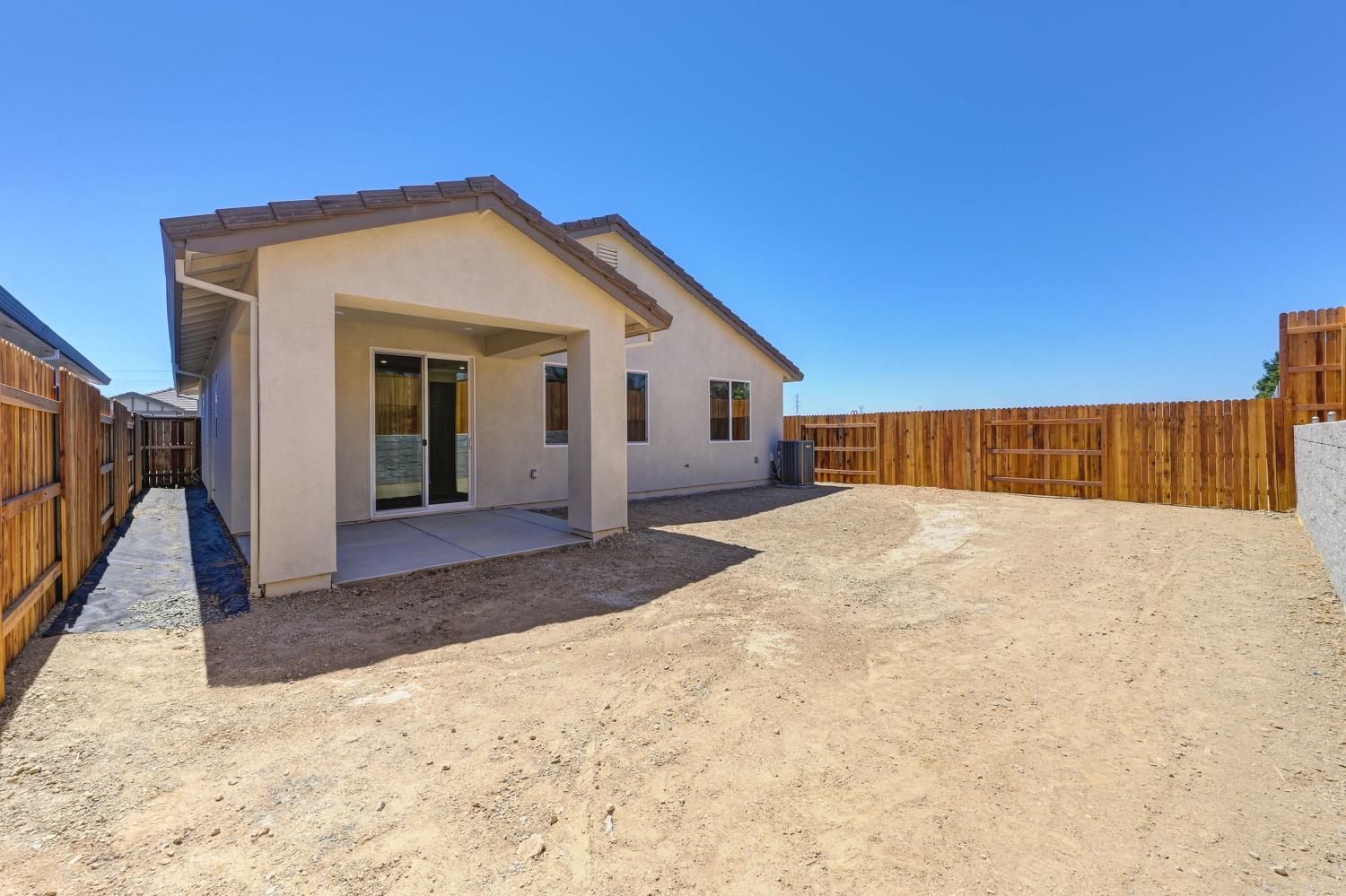 1089 Mallory Ridge Street Roseville, CA 95747 - Photo 34 of 36 a view of a house with a backyard