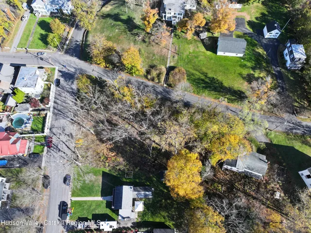a view of a house with a yard and garden