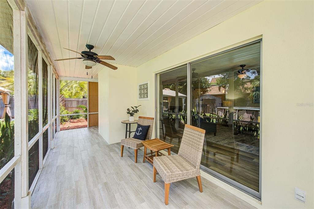14079 Victoria Road Largo, FL 33774 - Photo 18 of 46 a living room with a couch and a table