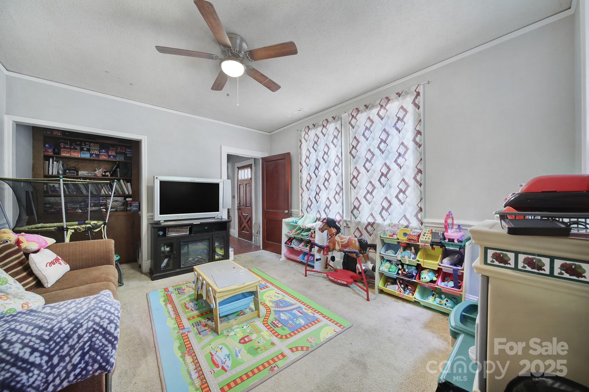 504 Chesterfield Avenue Lancaster, SC 29720 - Photo 11 of 24 a living room with furniture and a flat screen tv