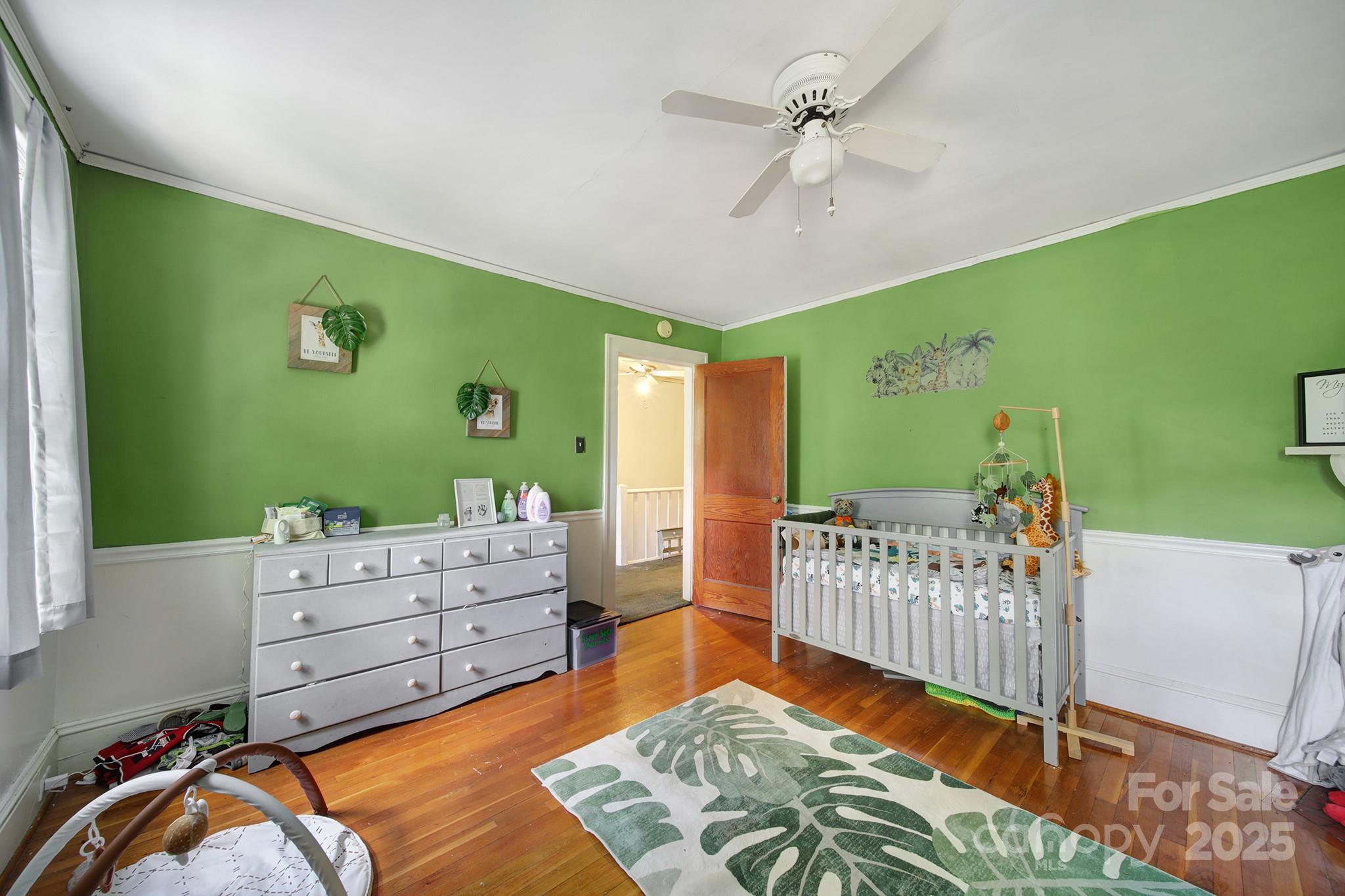 504 Chesterfield Avenue Lancaster, SC 29720 - Photo 16 of 24 a bedroom with furniture and a large window