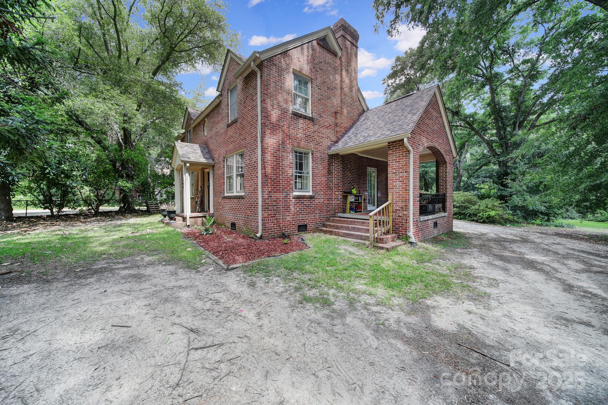 504 Chesterfield Avenue Lancaster, SC 29720 - Photo 2 of 24 a view of a house with backyard and garden