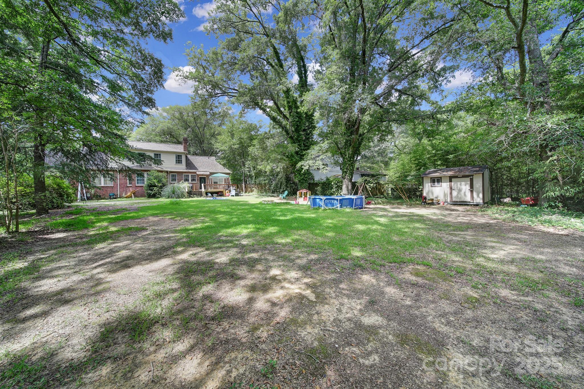 504 Chesterfield Avenue Lancaster, SC 29720 - Photo 23 of 24 a view of a house with backyard and trees