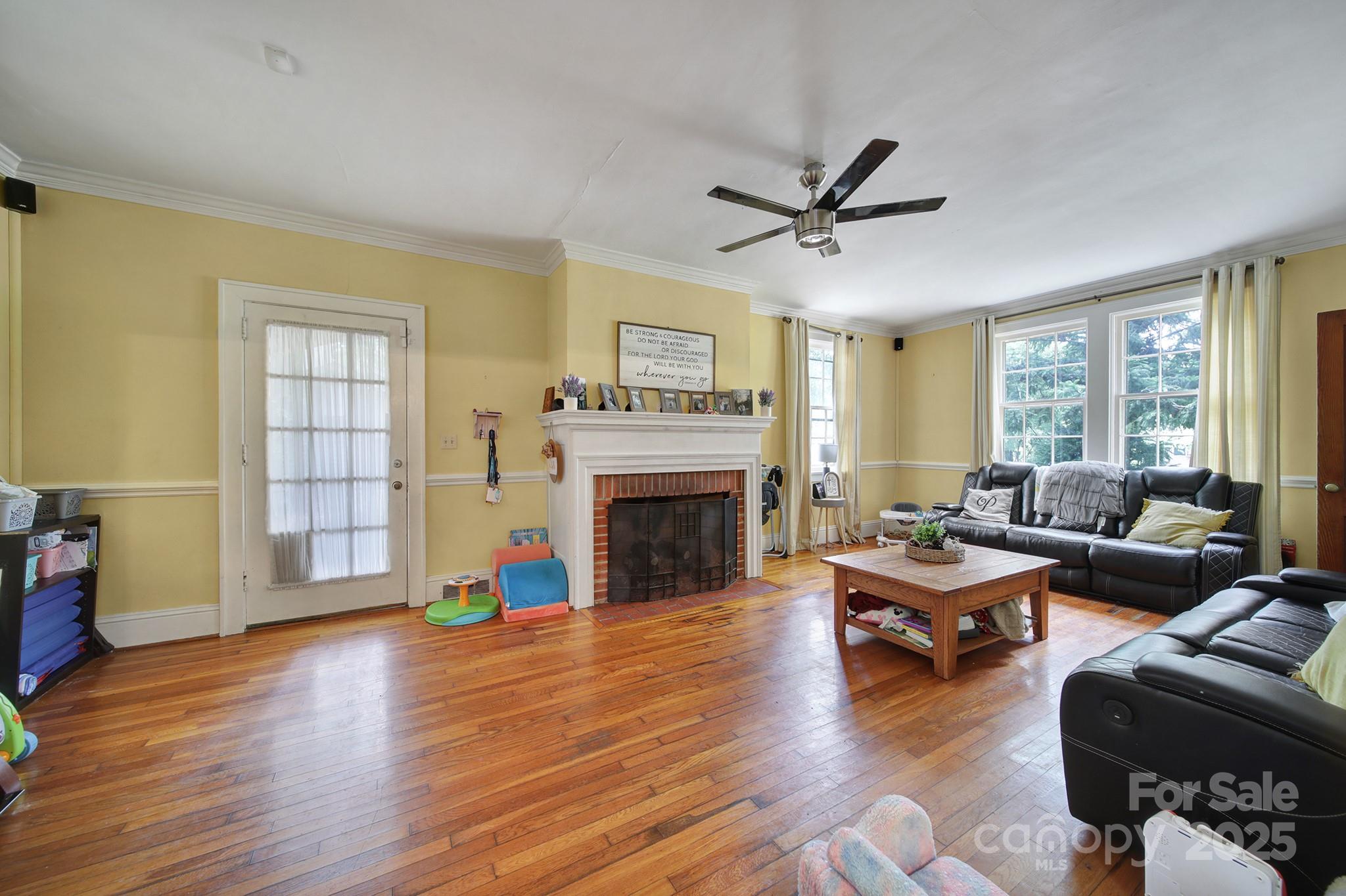 504 Chesterfield Avenue Lancaster, SC 29720 - Photo 3 of 24 a living room with furniture and a fireplace