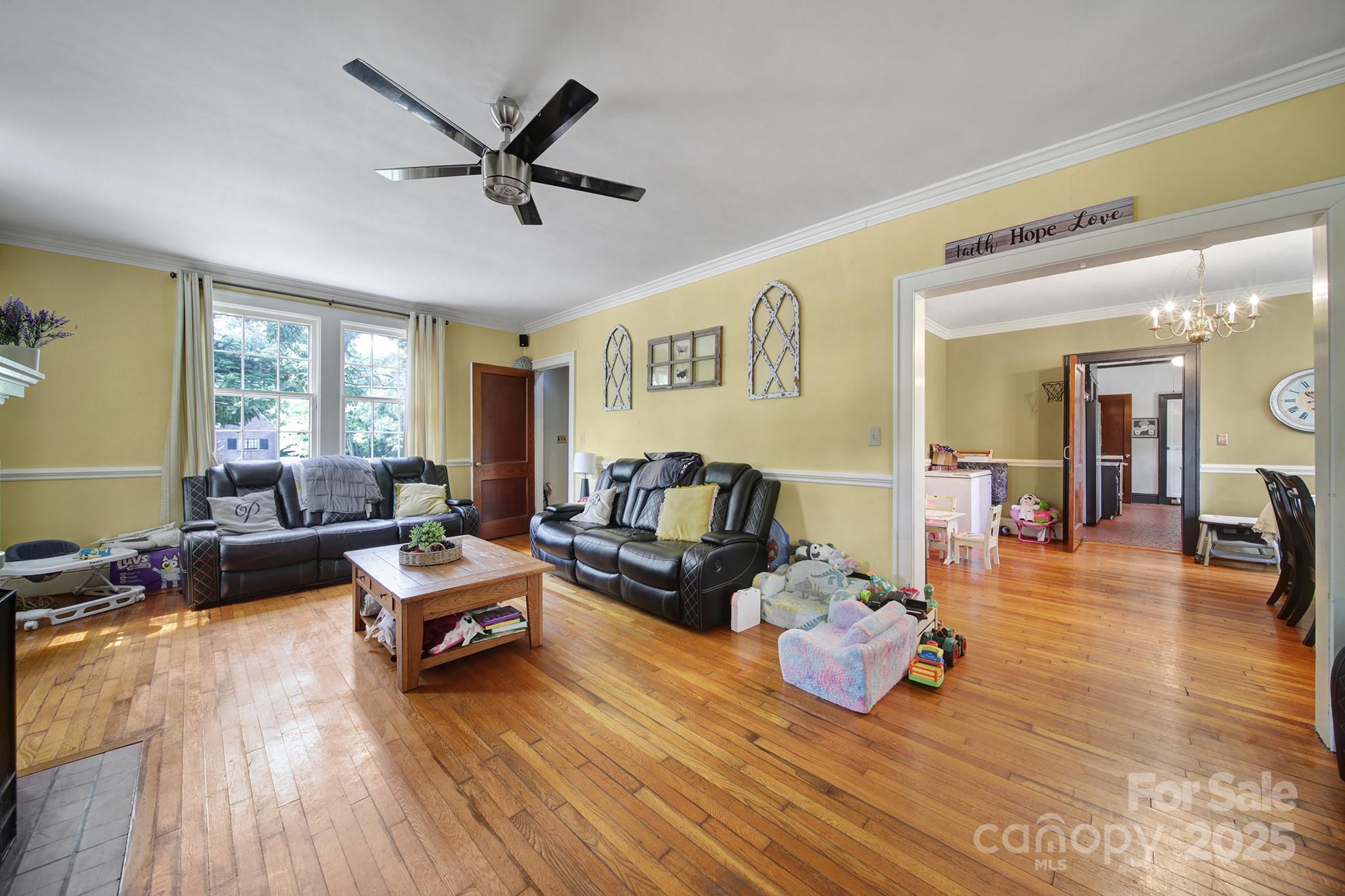504 Chesterfield Avenue Lancaster, SC 29720 - Photo 4 of 24 a living room with furniture and wooden floor