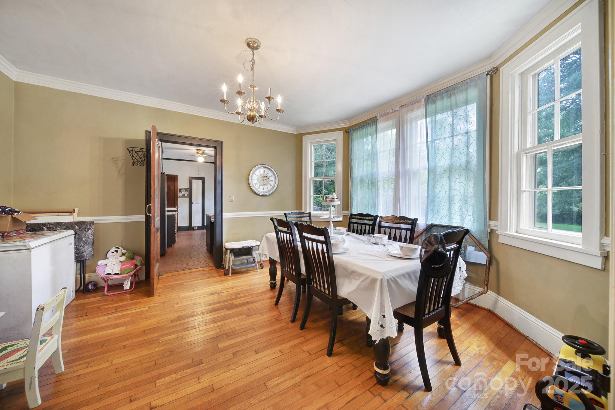 504 Chesterfield Avenue Lancaster, SC 29720 - Photo 6 of 24 a view of a dining room with furniture window and wooden floor