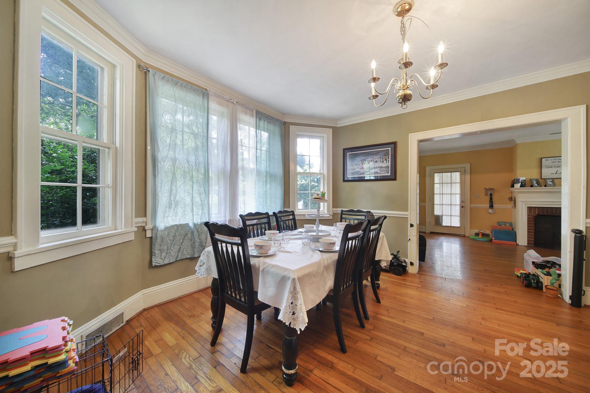 504 Chesterfield Avenue Lancaster, SC 29720 - Photo 7 of 24 a view of a dining room with furniture window and wooden floor