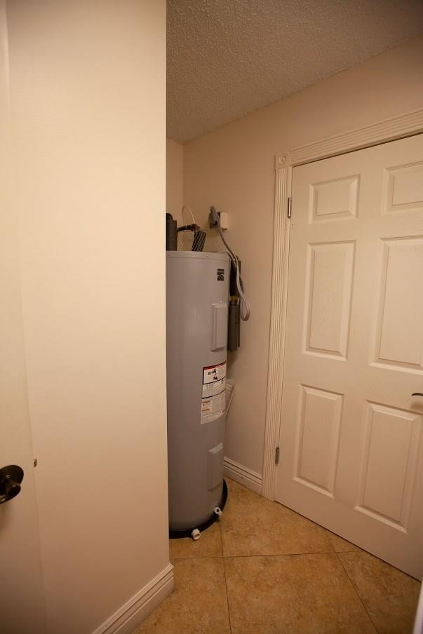 21836 Reflection Lane Boca Raton, FL 33428 - Photo 43 of 58 a view of a storage & utility room with a fireplace