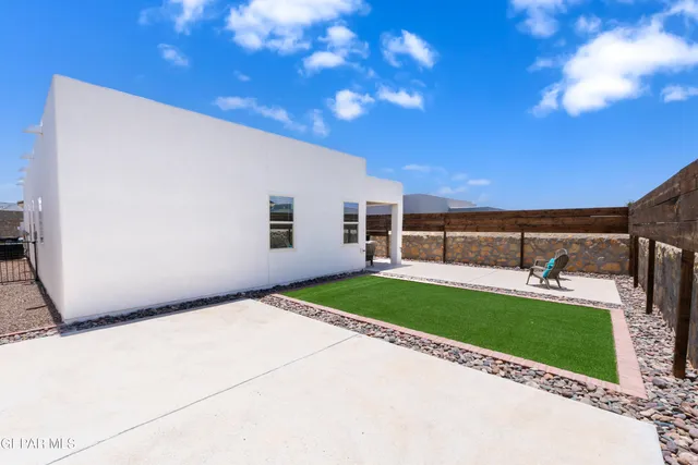 a view of a backyard with patio