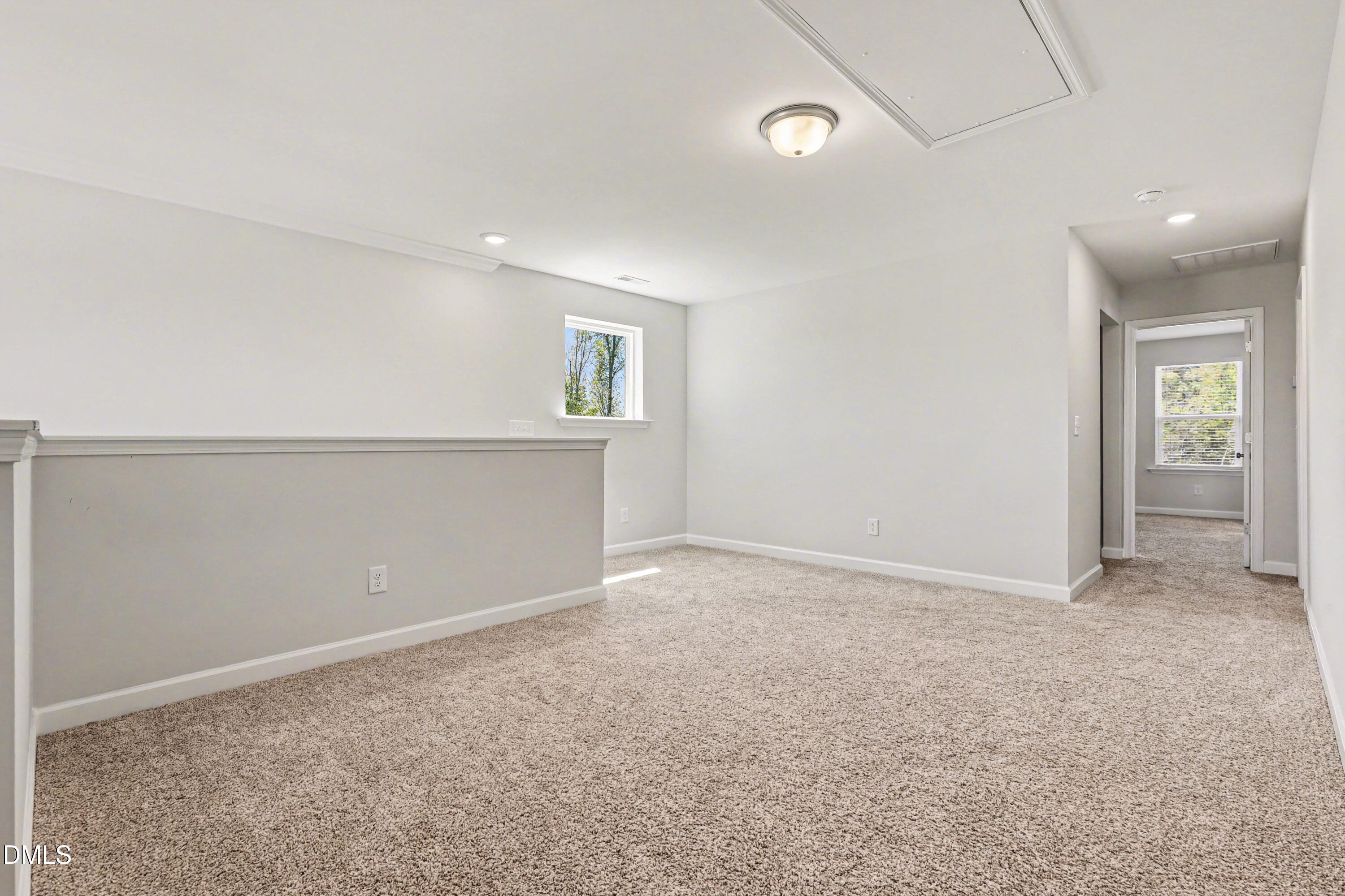 90 Rigsby Avenue Four Oaks, NC 27524 - Photo 24 of 43 an empty room with an entryway