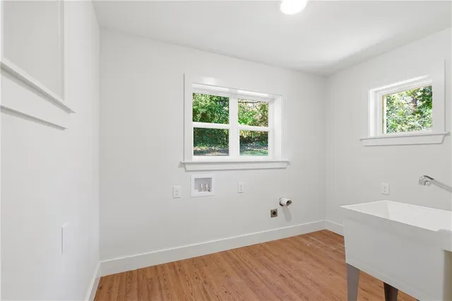 a room with a window and a wooden floor