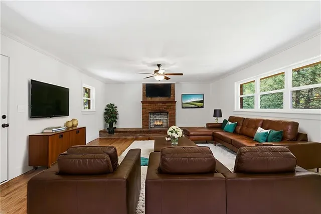 a living room with furniture and a flat screen tv