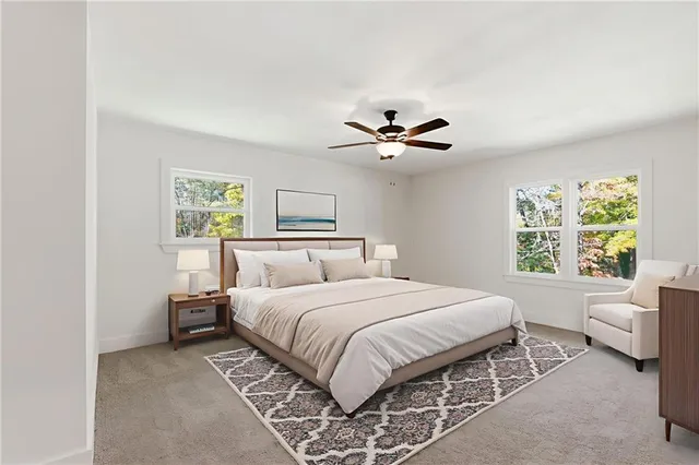 a bedroom with a large bed and a window