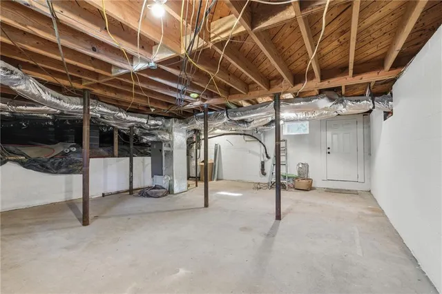 a view of a room with wooden walls