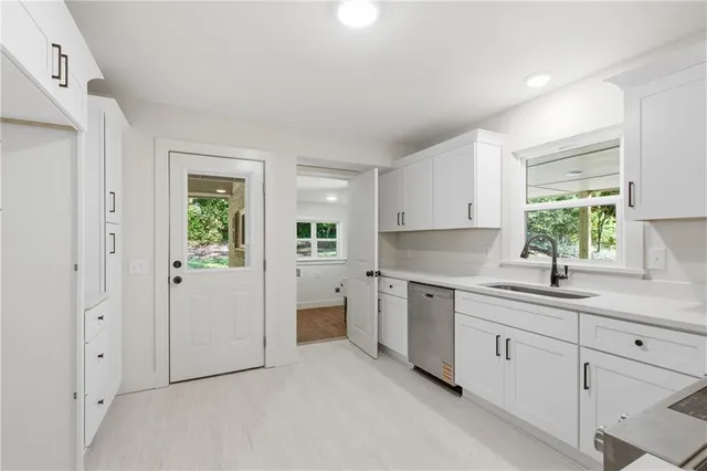 a kitchen with a sink and cabinets