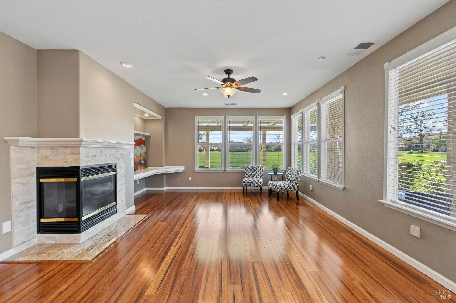 309 Southern Hills Drive Rio Vista, CA 94571 - Photo 10 of 73 dramatic corner fireplace and bamboo wood flooring in great room