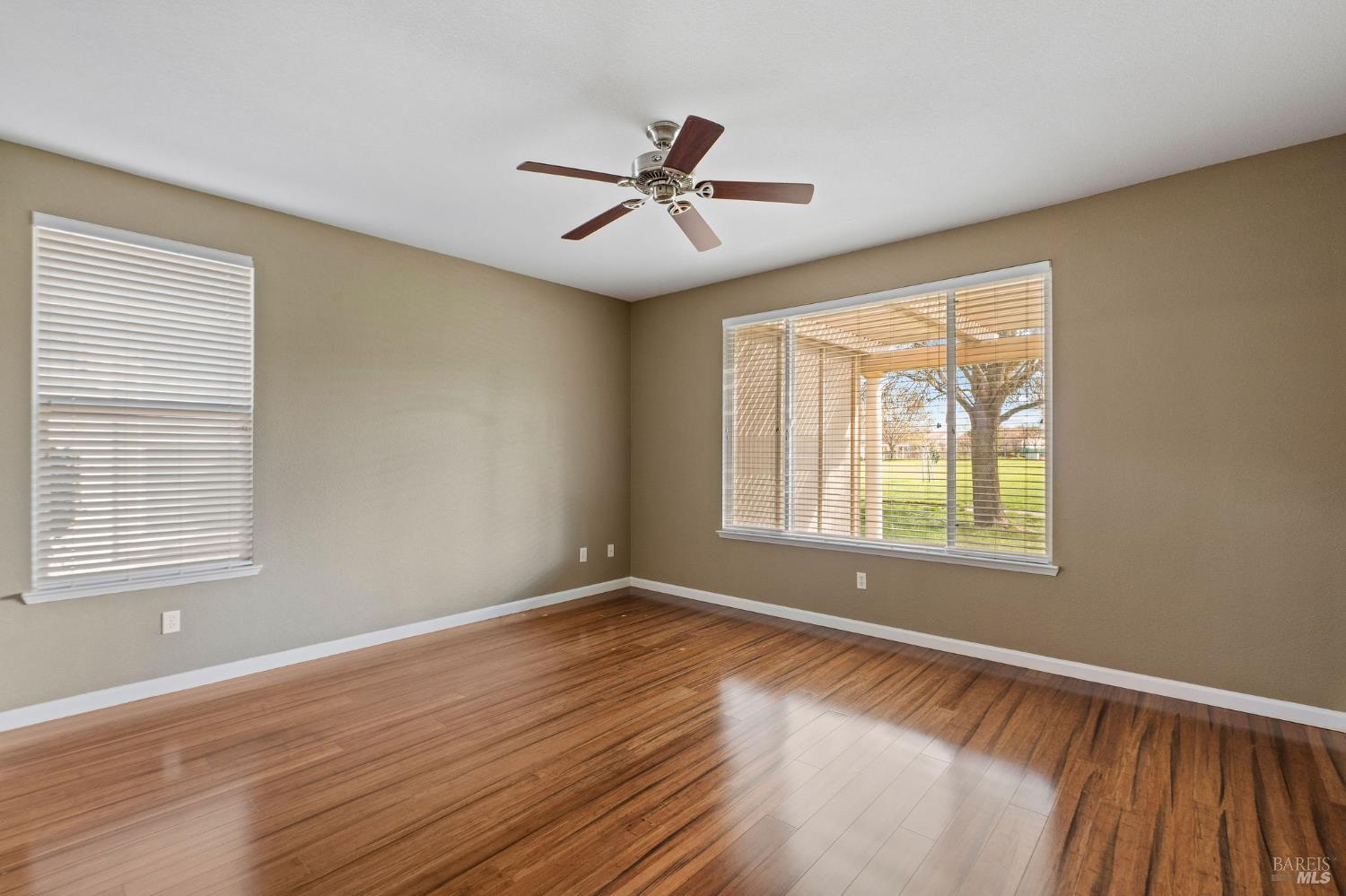 309 Southern Hills Drive Rio Vista, CA 94571 - Photo 16 of 73 a view of an empty room with wooden floor and a window