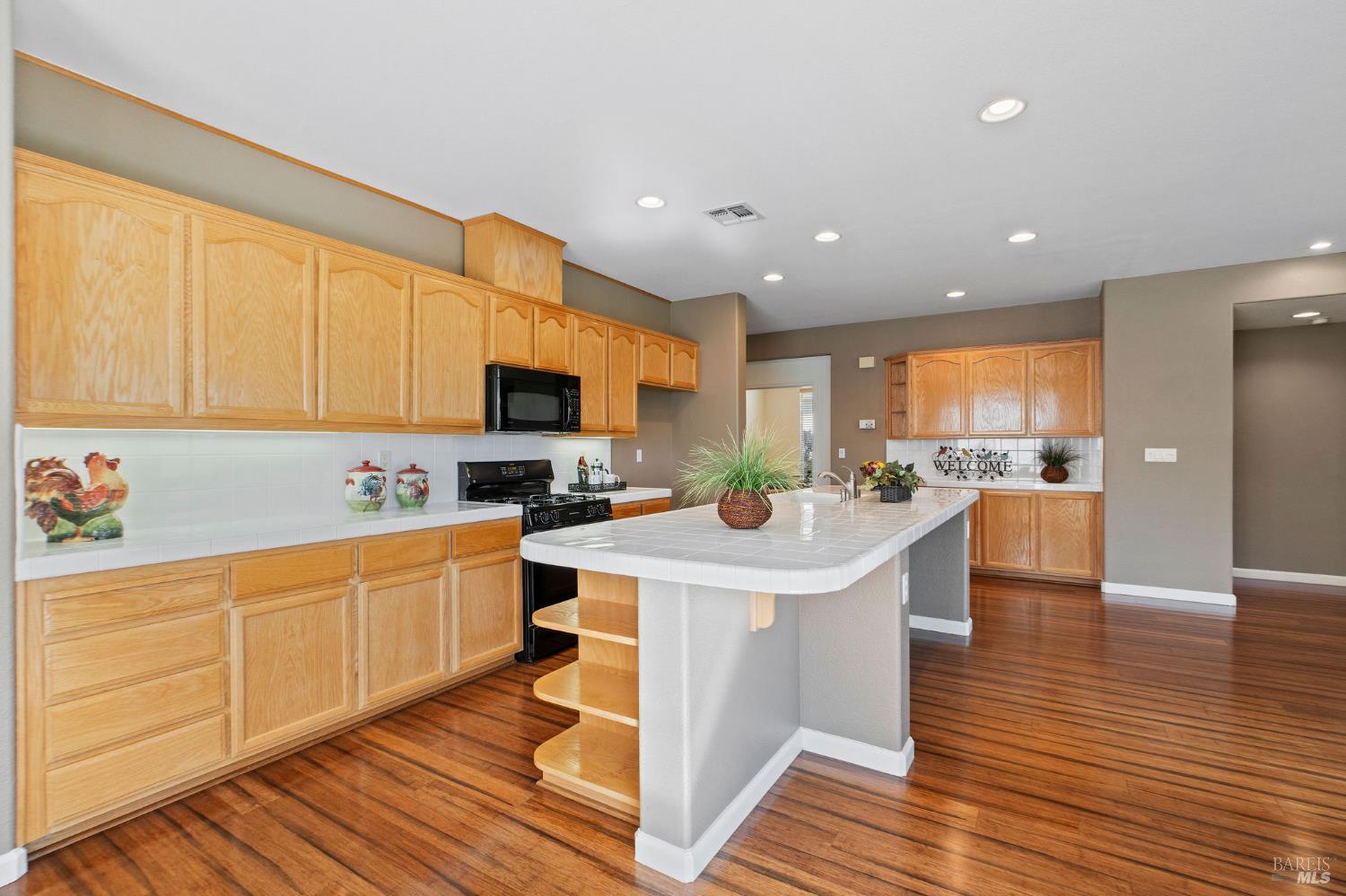 309 Southern Hills Drive Rio Vista, CA 94571 - Photo 8 of 73 a kitchen with stainless steel appliances kitchen island granite countertop a sink and cabinets