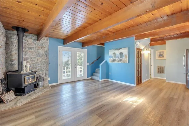 a view of an empty room with a fireplace