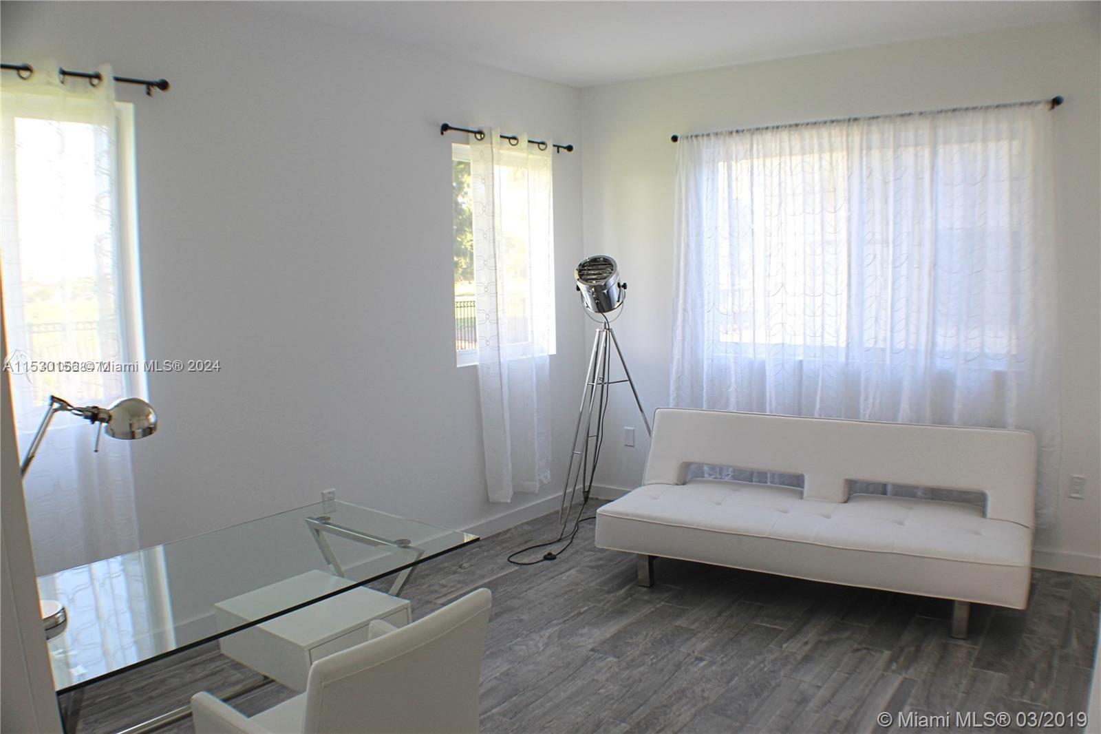 Normandy Shores Miami Beach, FL 33141 - Photo 8 of 13 a bathroom with a tub and a window