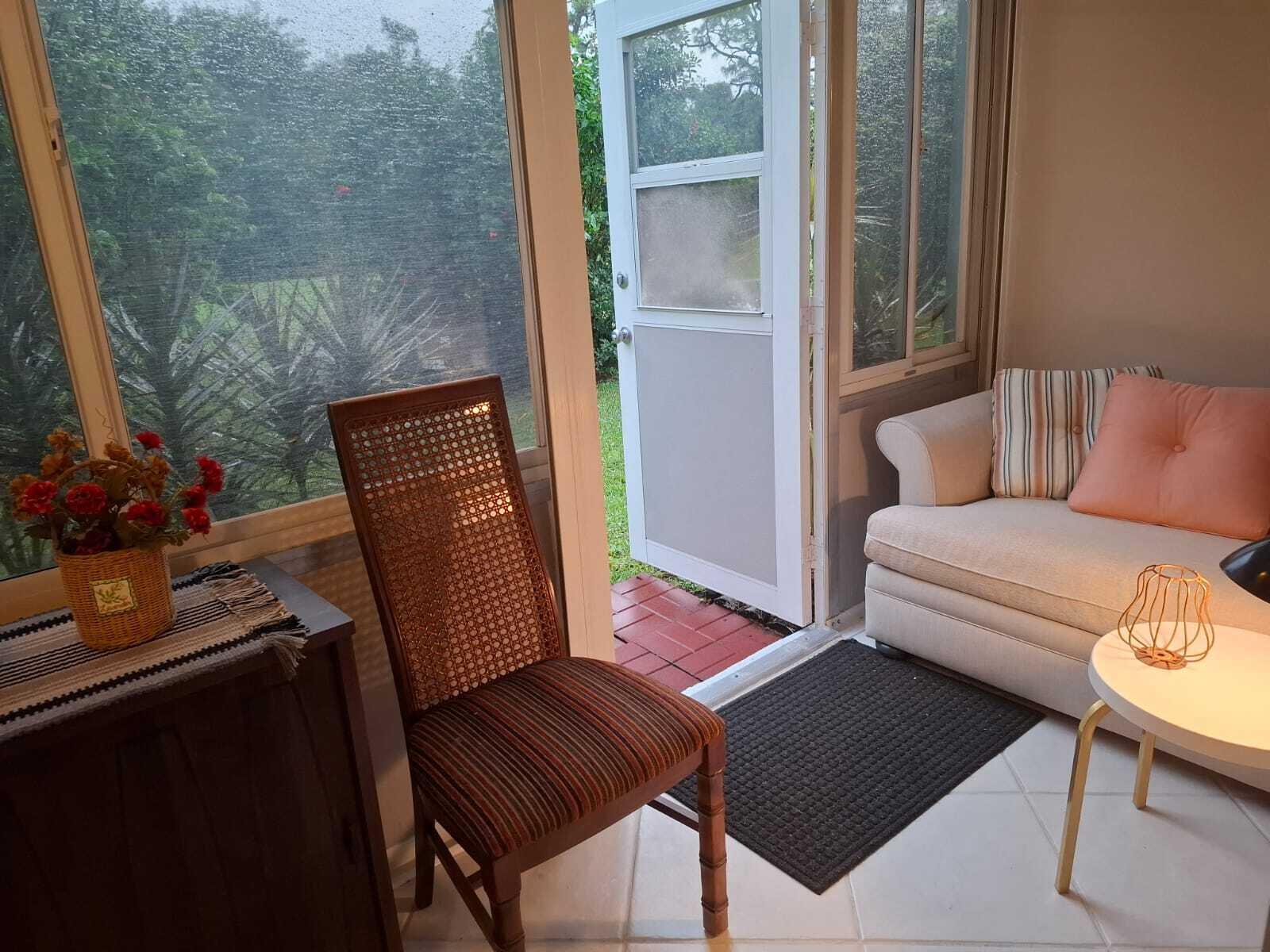 30 Oakridge C, Unit 30 Deerfield Beach, FL 33442 - Photo 3 of 12 a view of sitting area with furniture and wooden floor