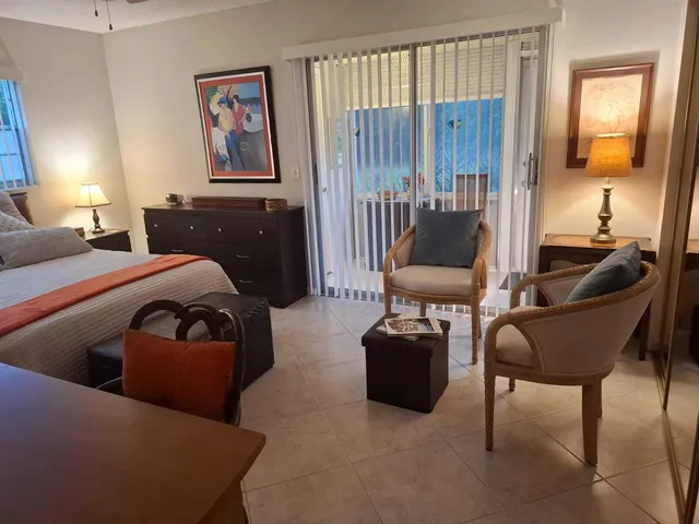 a bedroom with a bed and furniture