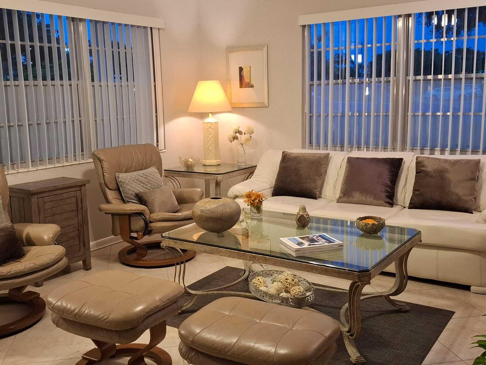 30 Oakridge C, Unit 30 Deerfield Beach, FL 33442 - Photo 9 of 12 a living room with furniture and wooden floor