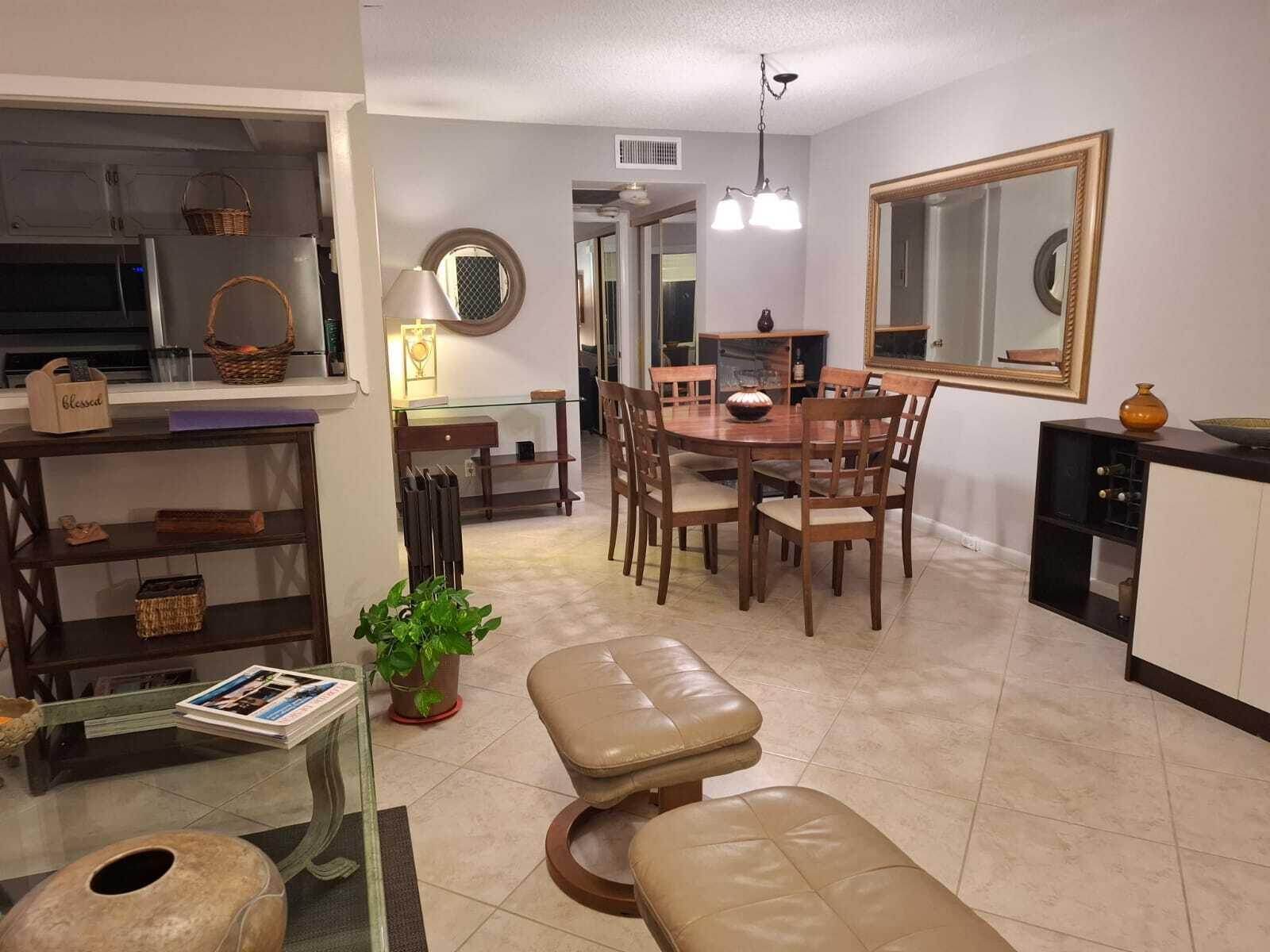 30 Oakridge C, Unit 30 Deerfield Beach, FL 33442 - Photo 10 of 12 a view of a dining room with furniture