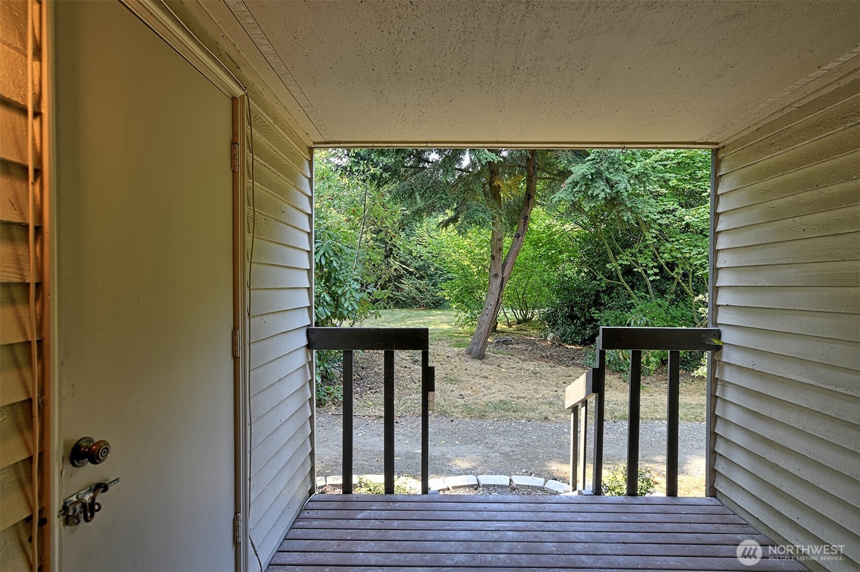 120 124th Street Southwest, Unit C8 Everett, WA 98204 - Photo 12 of 30 a view of a balcony with wooden floor