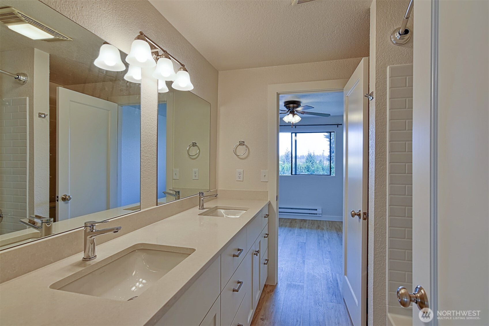 120 124th Street Southwest, Unit C8 Everett, WA 98204 - Photo 15 of 30 a bathroom with a double vanity sink and a mirror