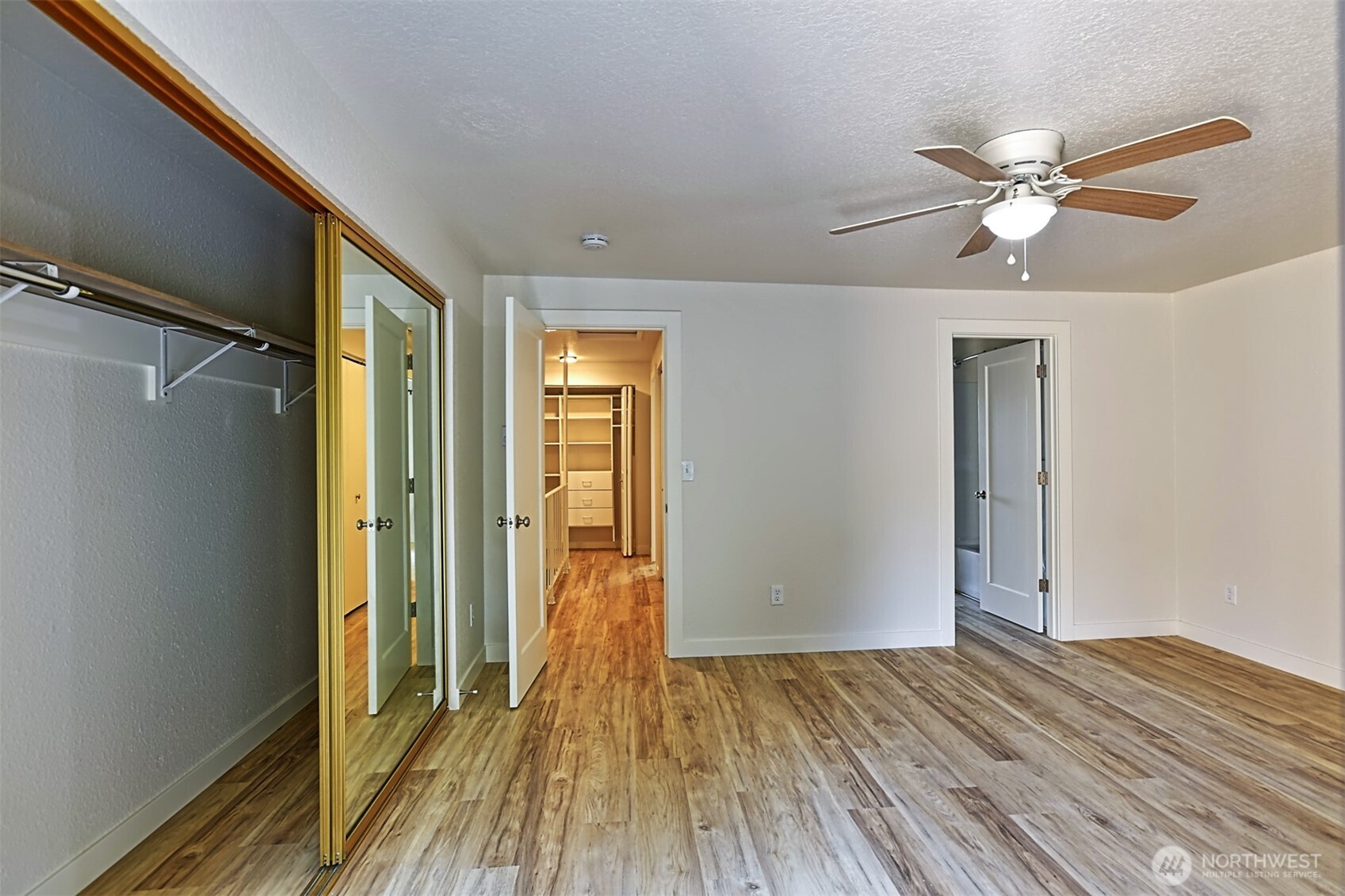 120 124th Street Southwest, Unit C8 Everett, WA 98204 - Photo 16 of 30 a view of empty room with wooden floor and fan