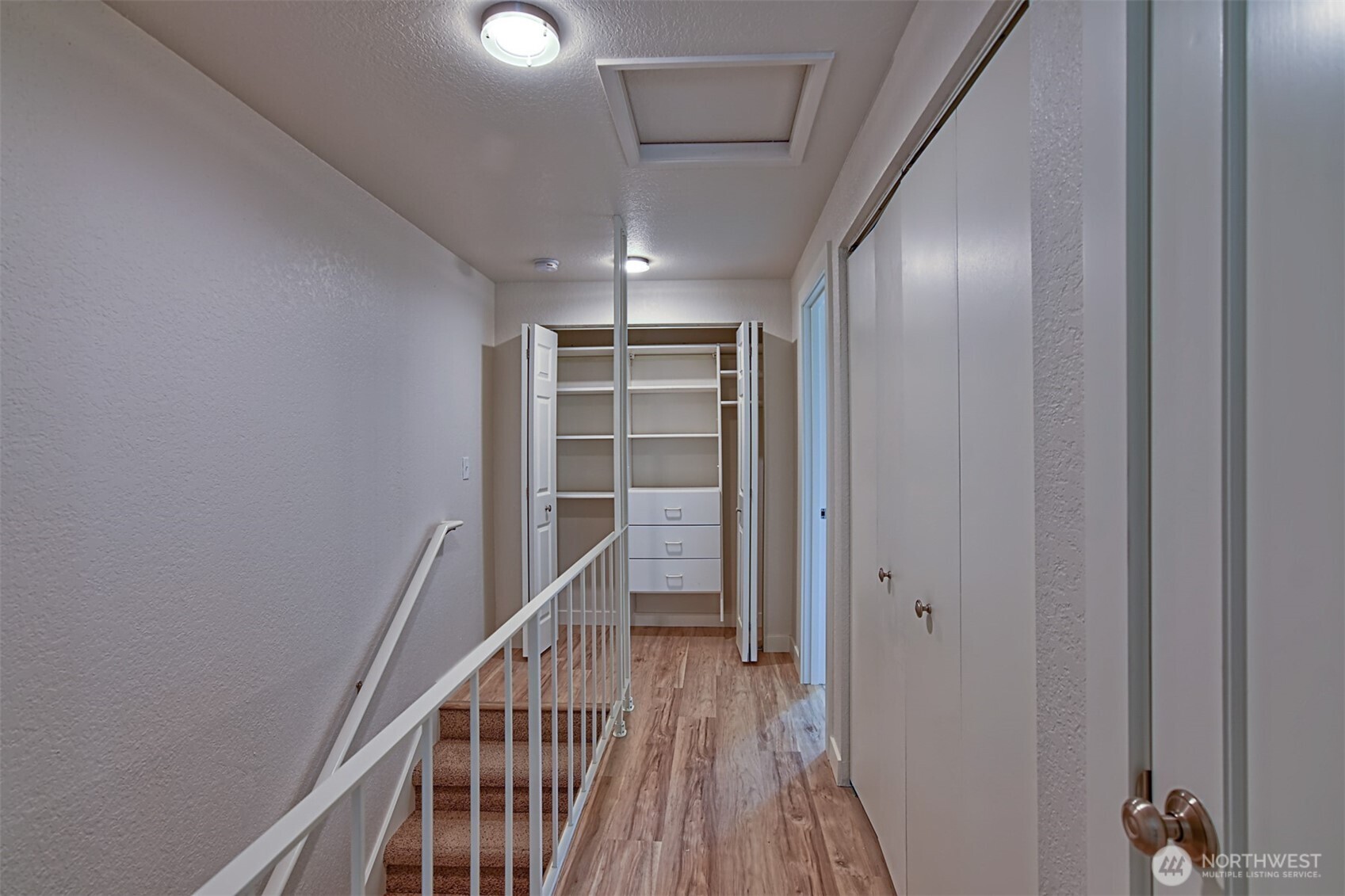 120 124th Street Southwest, Unit C8 Everett, WA 98204 - Photo 19 of 30 a view of a hallway with wooden floor and staircase