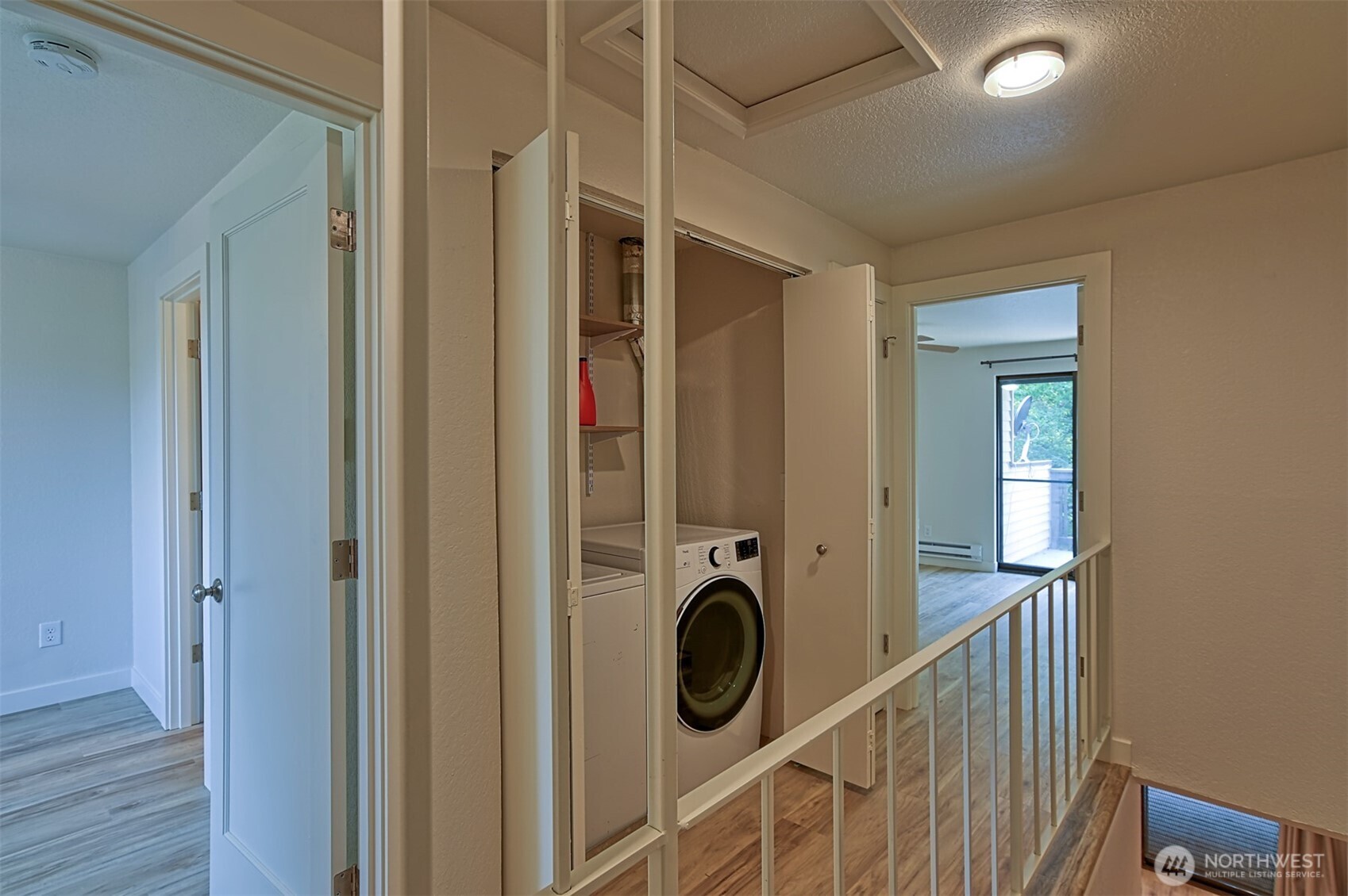 120 124th Street Southwest, Unit C8 Everett, WA 98204 - Photo 20 of 30 a view of a hallway with washer and dryer