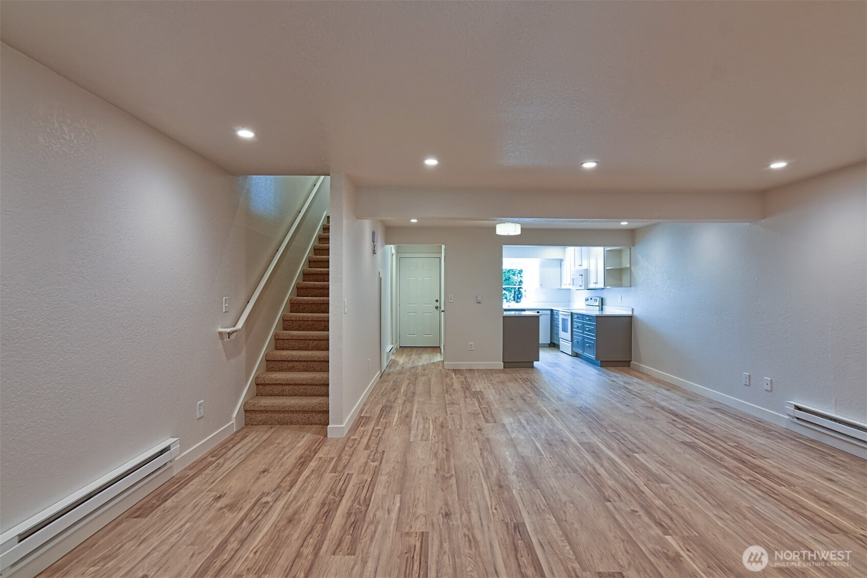 120 124th Street Southwest, Unit C8 Everett, WA 98204 - Photo 2 of 30 a view of a big room with wooden floor and staircase