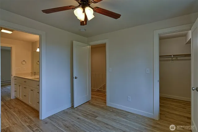 wooden floor in an empty room with a mirror